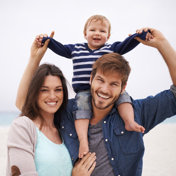 family of three enjoying time together outside